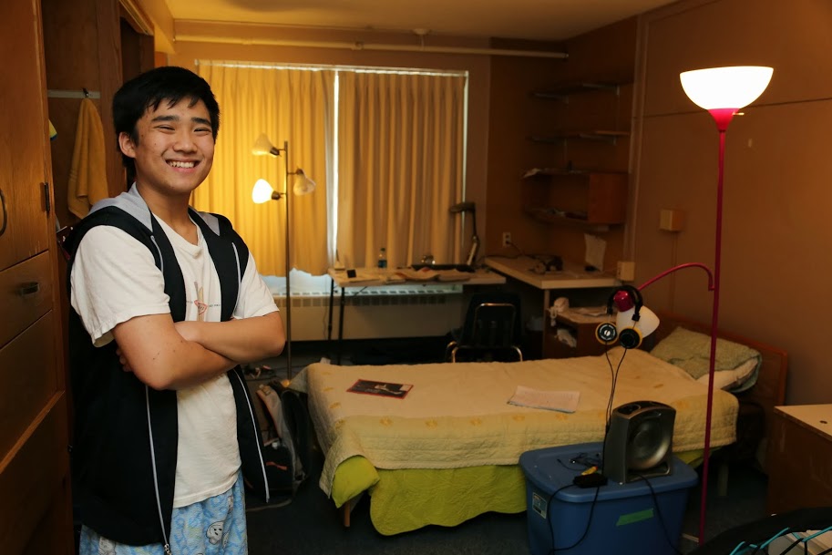 David Moon - A senior this year, stands in front of his sparkling clean room.