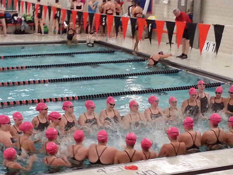 The+WSH+swim+team+warms+up+with+Cotter+students.