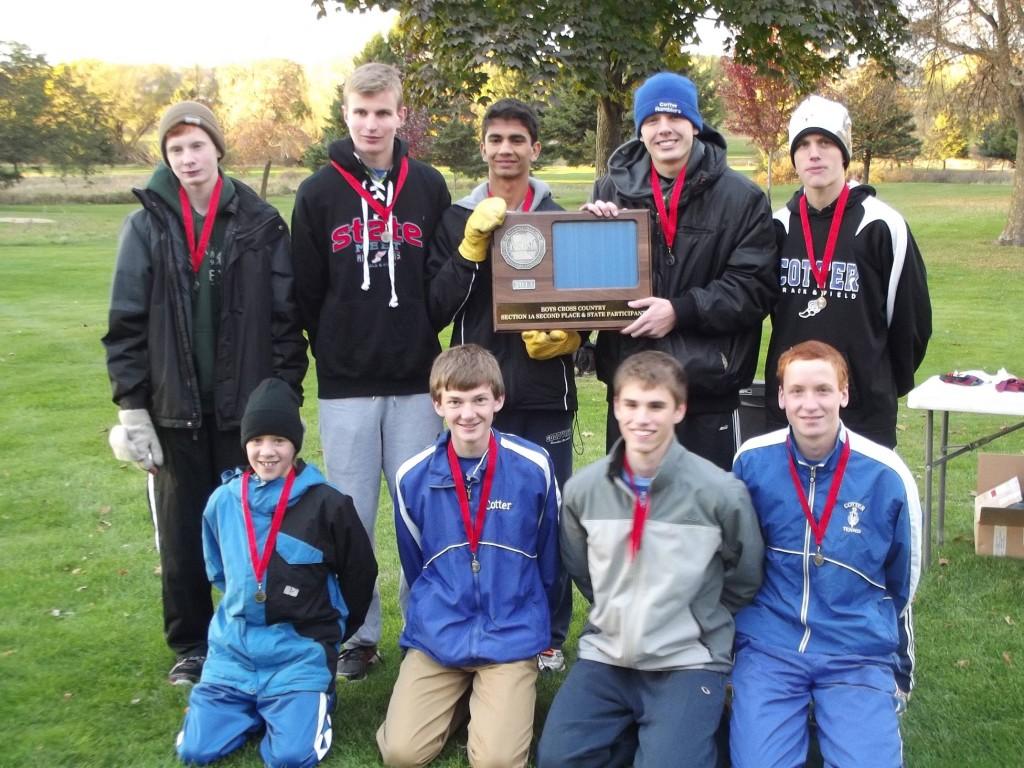 The Cotter Boys Cross Country team poses with their awards