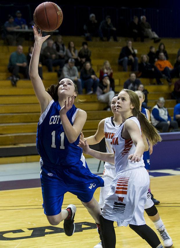 Junior Gabby Bowlin goes up for a layup past Winonas Hallee Hoeppner in last years Lewiston Auto Holiday Tournament. Bowlin, who averaged 16.8 points per game last year, is one of the conferences leading scorers.