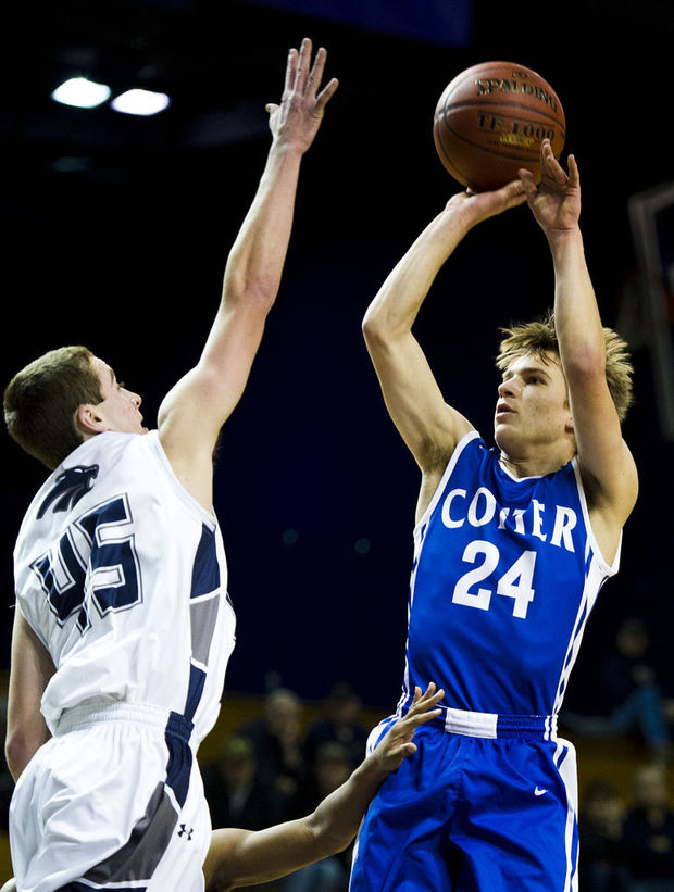 Senior guard Jonah Spiten shoots over a Zumbrota-Mazeppa defender in last years Lewiston Auto Holiday Tournament. Spiten leads the team in scoring with 16.5 PPG so far this season.