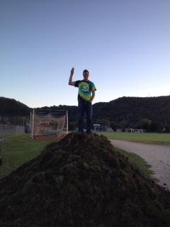 Noah Nachtigal stands upon mounds of grass at Cotters Field of Dreams