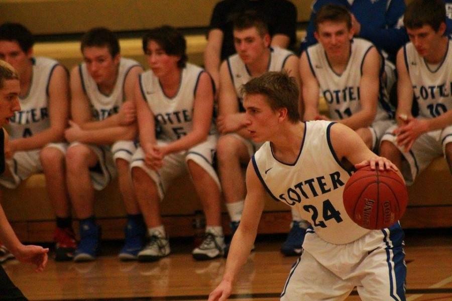 Cotters Jonah Spiten (24) sees the court as a Caledonia defender applies defense