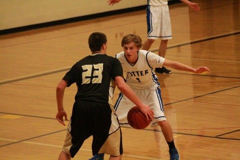 Cotter's Logan De Vorak (1) defends against Caledonia's Owen King (23)