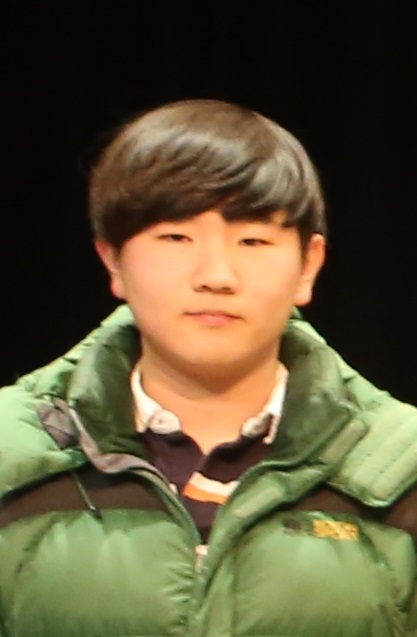 Sang-Hyuk Lee poses for the camera during the Cotter Math Team state sendoff.