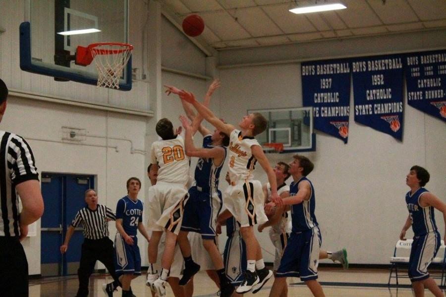 Cotter's Hunter Andre (23) goes for a shot between P-E-M defenders Carson Root (0) and Michael Veenhuis (20). Andre hit the game-winning shot as time expired in overtime
