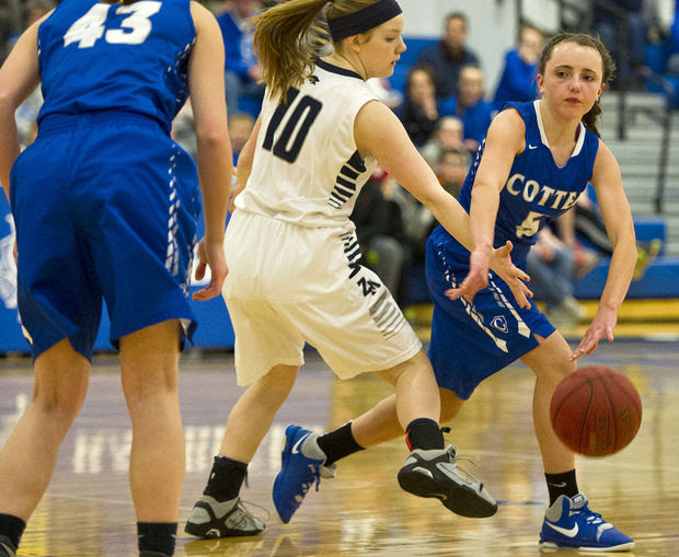 Cotter's Mary Morgan (5) attempts a pass to Mikala Nelton (43) during Thursday's victory over Zumbrota-Mazeppa