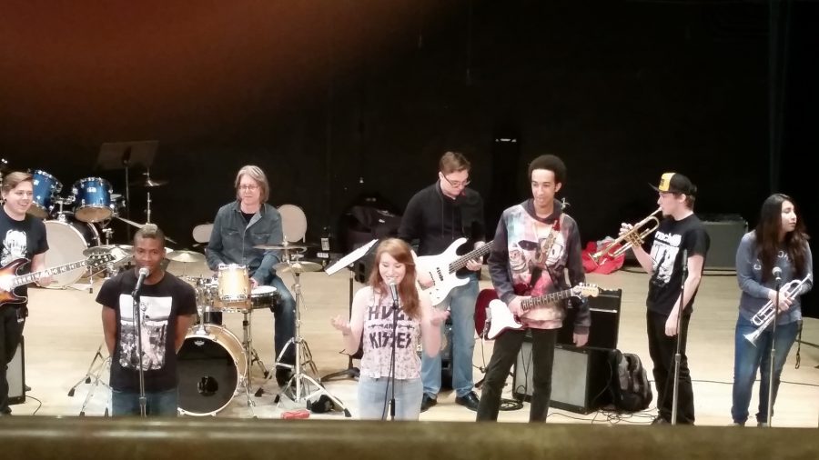 The McNally Smith SKA ensemble hangs out on stage before performing.
