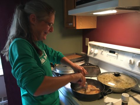 Carol prepares food in the dorm kitchen