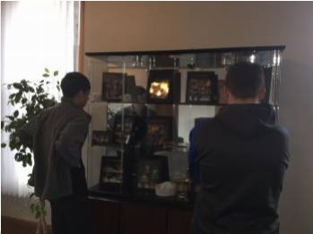 Students check out new display case in theater lobby