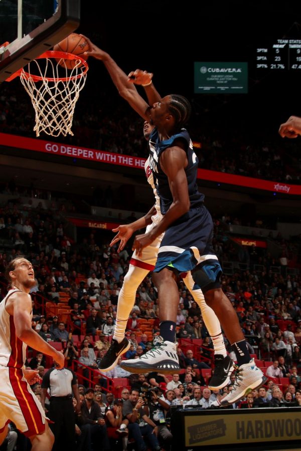Wolves guard Andrew Wiggins dunks on Miamis Josh Richardson. (Issac Baldizon/NBAE/Getty Images)
