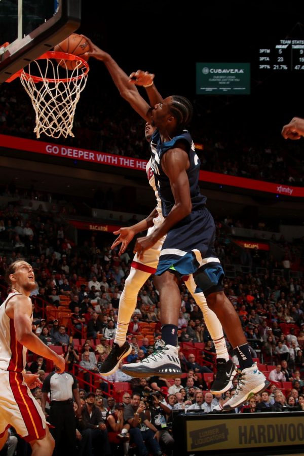 Wolves guard Andrew Wiggins dunks on Miami's Josh Richardson. (Issac Baldizon/NBAE/Getty Images)
