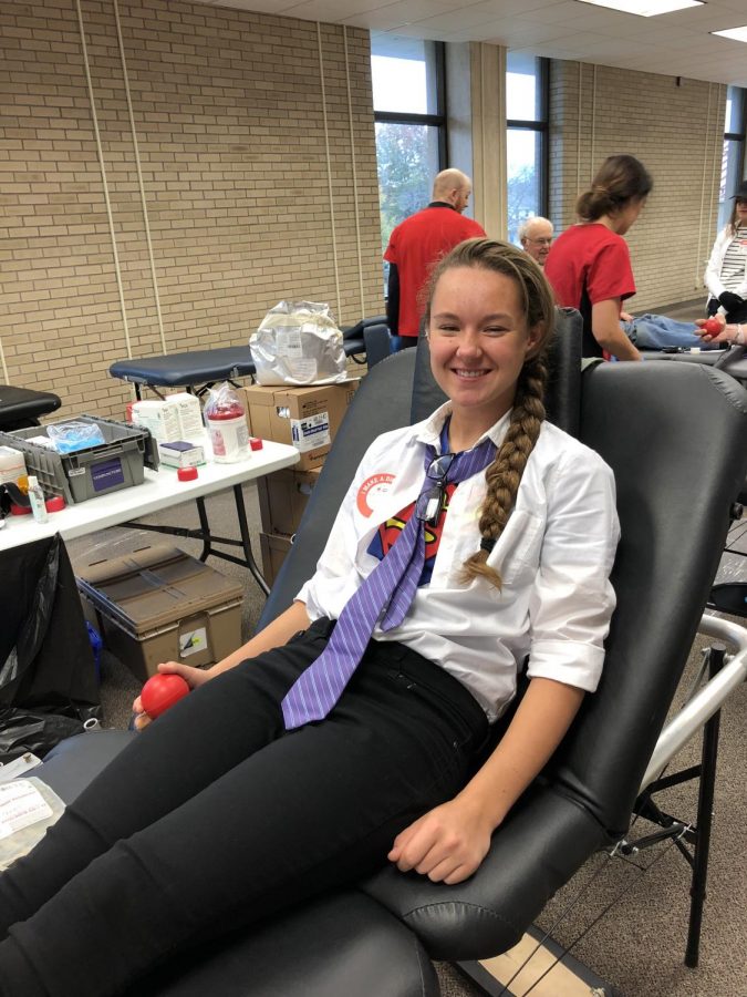 Paige Stalislawski donates to the Halloween blood drive