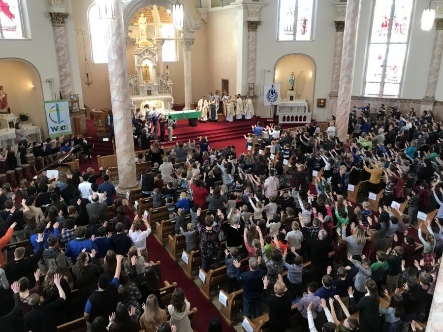 Fr. Jim Berning receives an ovation at CSW mass at St. Stan's on Feb. 1.  This was Fr. Jim's last mass with WACS and Cotter