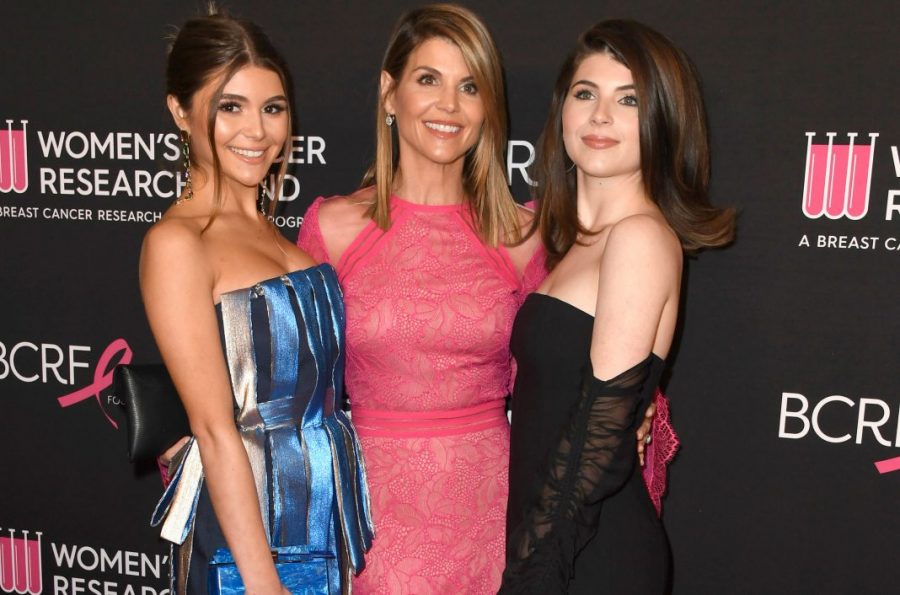 Lori Loughlin and her daughters, Bella and Olivia Jade pose for the camera before the scandal occured. 