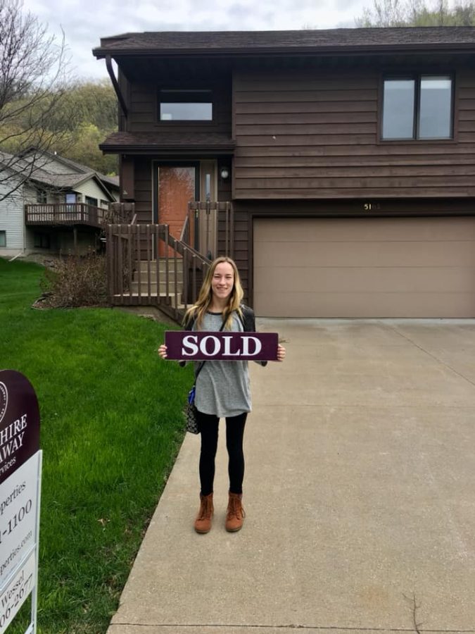 Alum, Chloe Trainor in front of new house