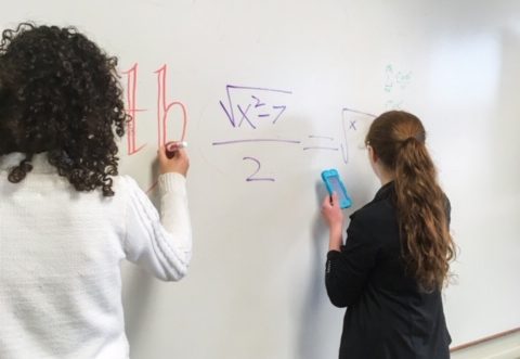 Cotter math team students at work at the board