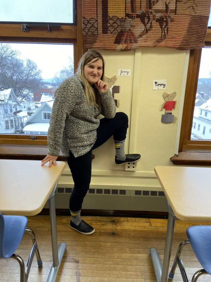 Mrs. Barrios wearing the "World's greatest teacher" socks
