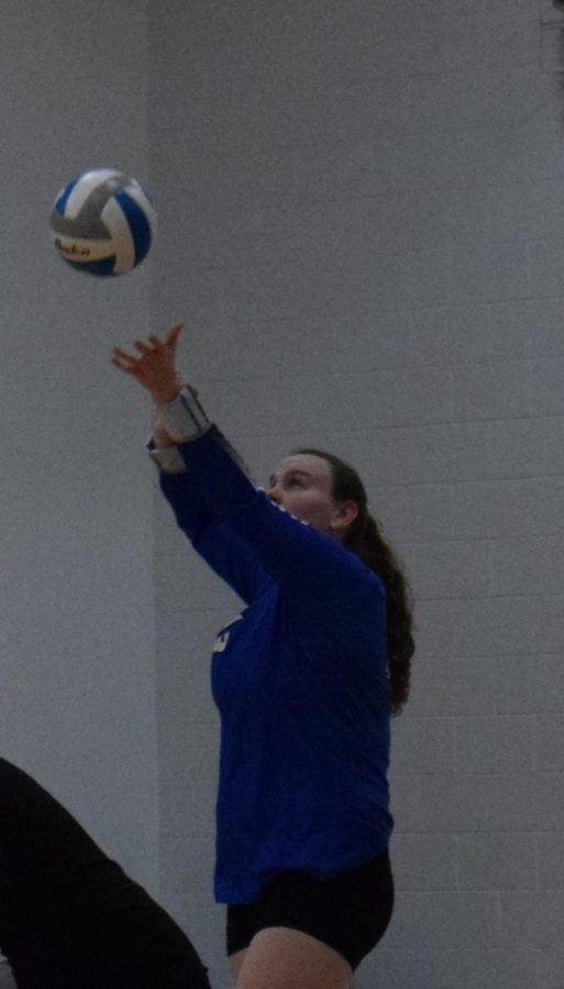 Kelli Hadaway serves the ball against Dover-Eyota.