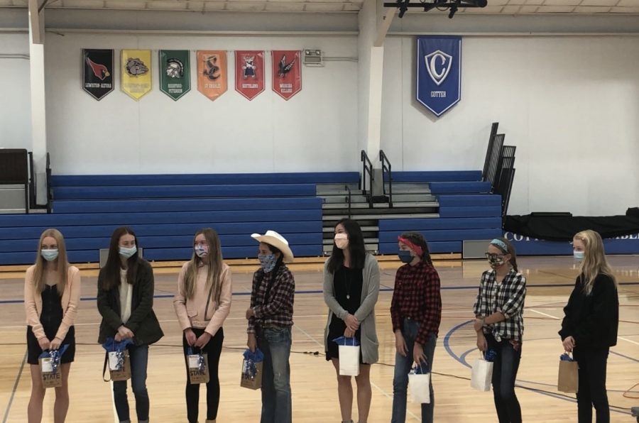 The+cross+country+girls+are+recognized+at+a+ceremony+in+the+gym+along+with+the+girls+soccer+team.++Both+teams+were+conference+and+section+champions.