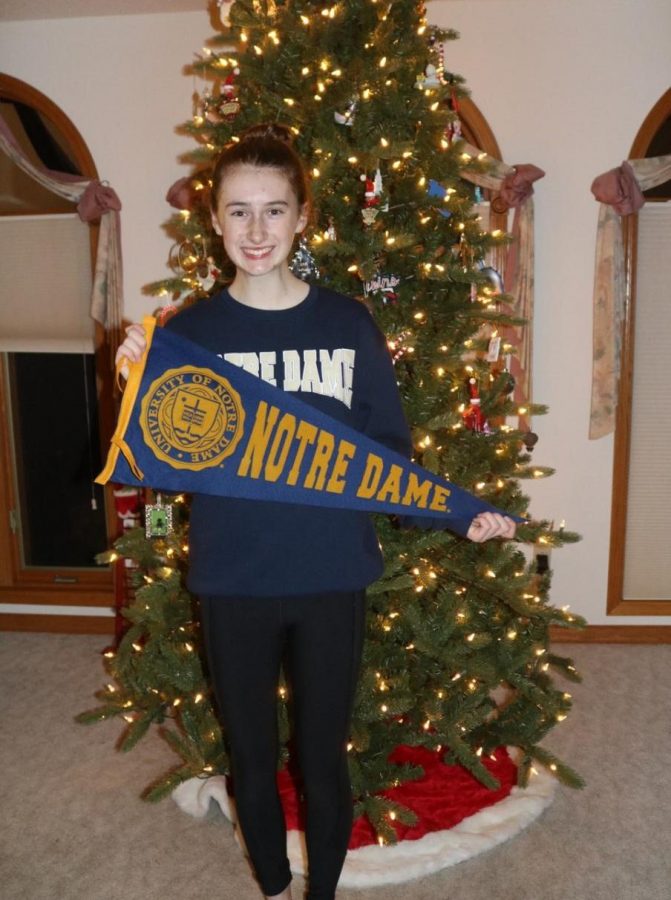 Aubrey Williams poses with her Notre Dame flag. Credit: Linda Williams.