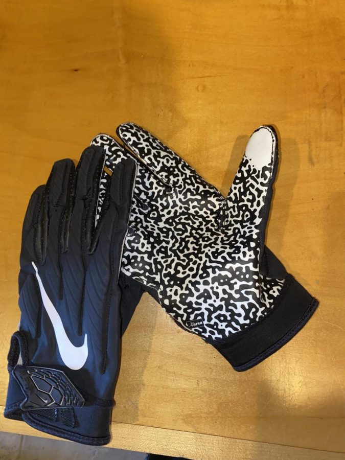 A broken in pair of Nikes Superbad football gloves