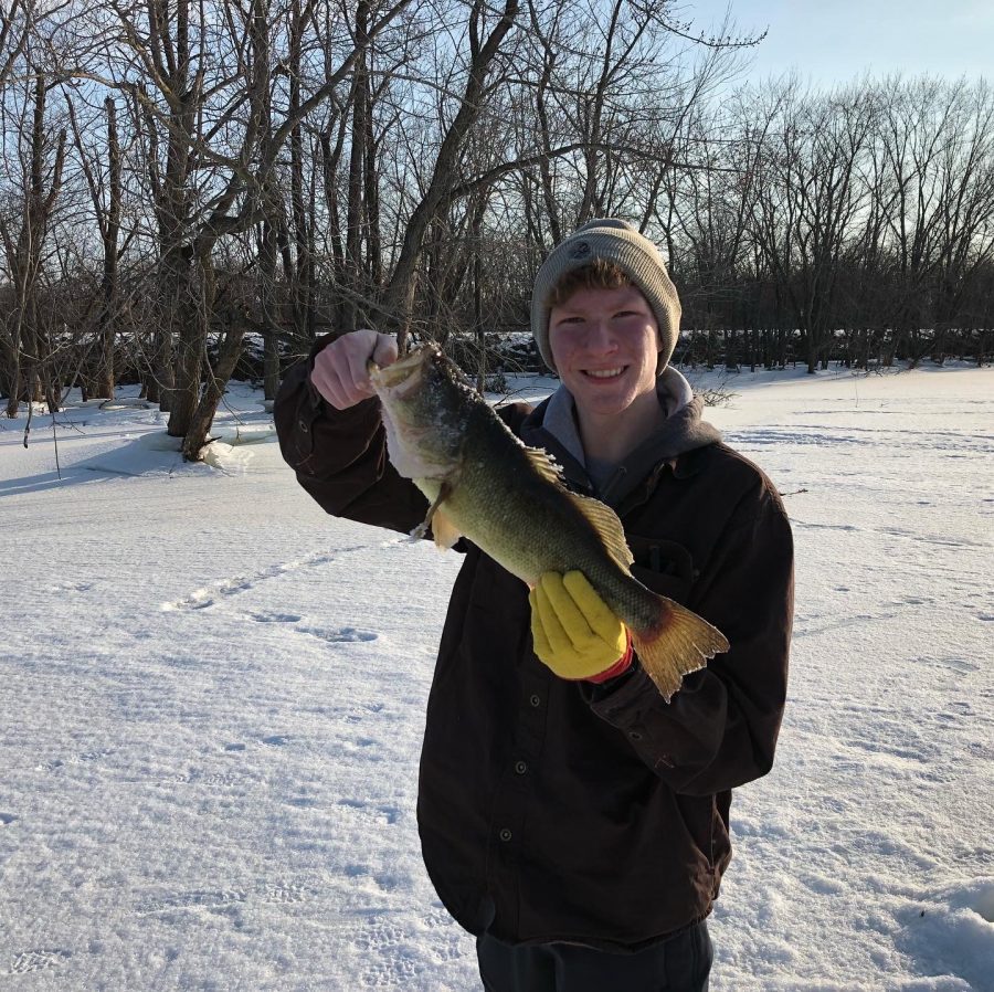 The reporter holds up a recent catch from the Mississippi RIver backwaters