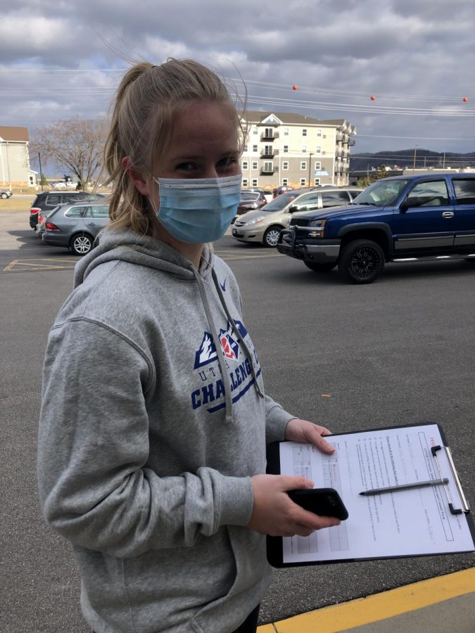 Cotter student Freya Brandvik waits in line at Winona Health to receive the Covid-19 vaccine