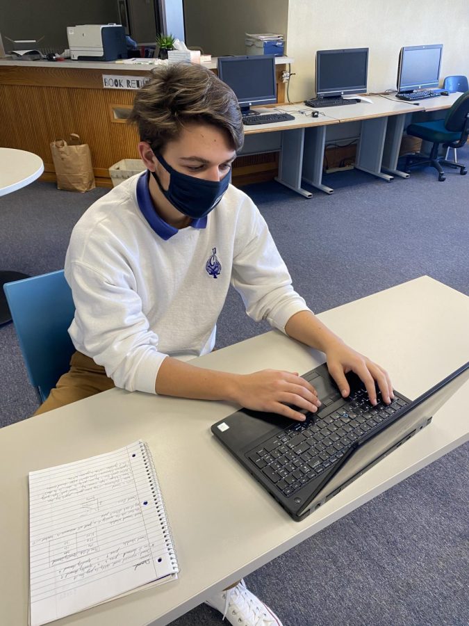 Rob Besek-"I like it for essay questions because I can type faster than writing in the paper."    Rob Besek working on an online assignment in the Media Center
