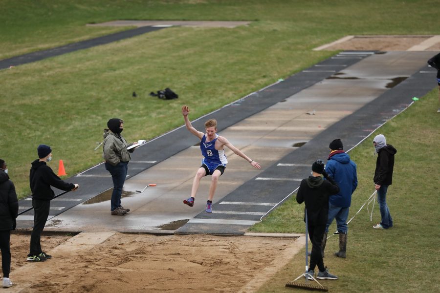 Cole Ebertowski competes in the high jump at the first track meet of the season in St. Charles