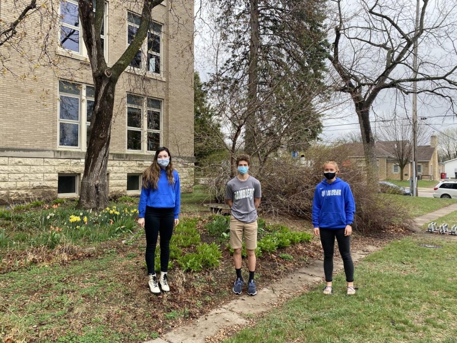 AP Physics students, Grace Menke, Cale Beckman, and Maren Stewart take a walk outside the Cotter building on April 9.