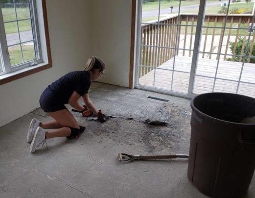 Alli Benson tears up a floor at a residential project working with her father