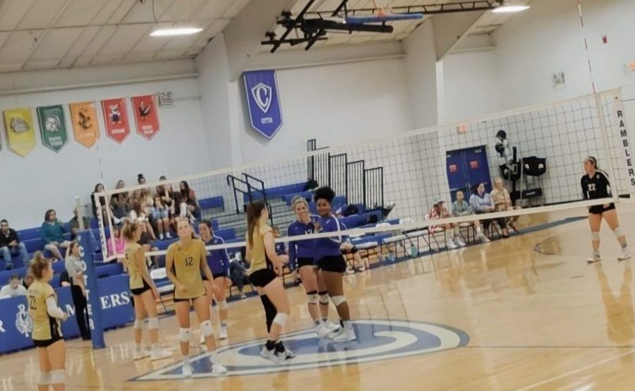 The girls volleyball team prior to the start of the match vs. Caledonia