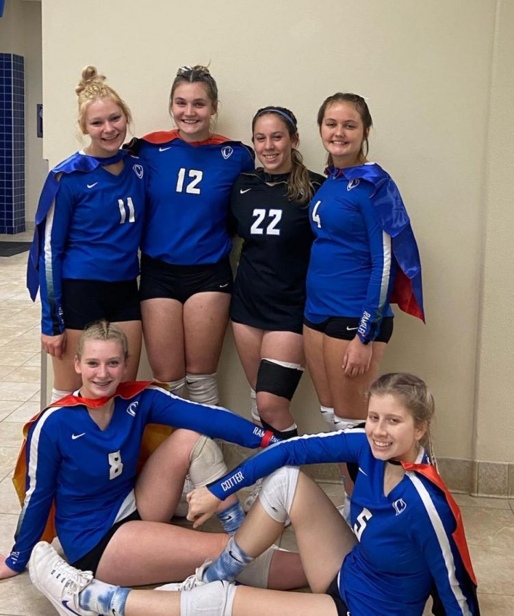 Cotter senior volleyball players pose in capes after their victory on senior night:
Top row: Madison Remarkiewicz, Olivia Blumers, Ali French and Andie Teske,  Seated: Rachel Millering and Lexi Danielson