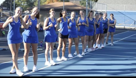 The Cotter tennis poses at a home meet.  The team looks to  lean on many returning players next season.