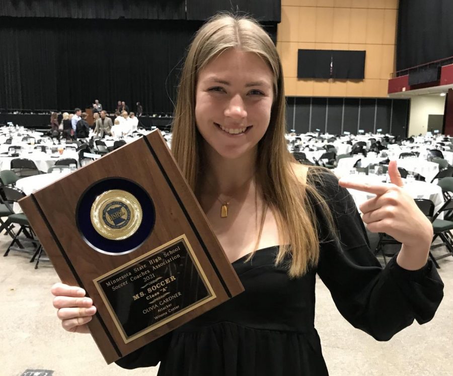 Olivia Gardner holding her Miss Soccer plaque at Sunday's State soccer banquet.