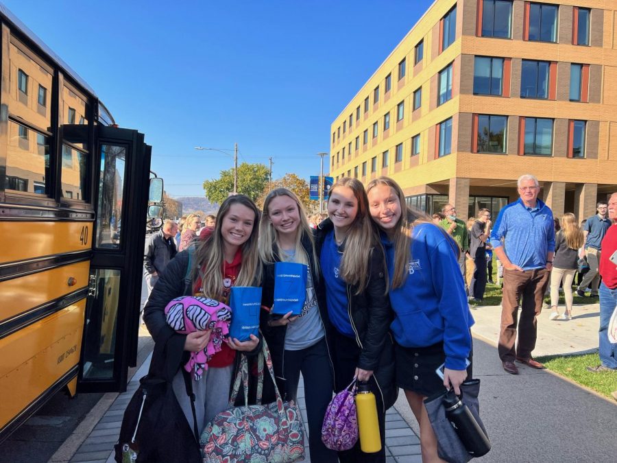 Ella Leaf, Amaiya Kaphusman, Anna Piechowski, and Grace Renk outside of Cotter prior to the soccer team departing for State. 