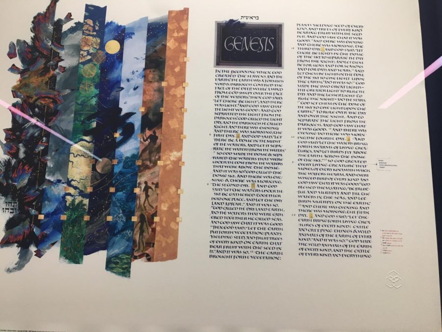 The seven days of creation are painted on the first page of the St. John's Bible, next to the calligraphed story of Creation. This print hangs in the entrance of Cotter's St. Joseph building. 