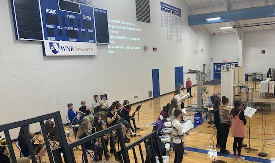 members of Cotter music ministry team lead the school in a rendition of Joy to the World to end the mass