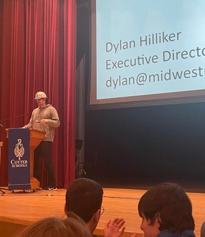 Dylan Hilliker addresses the students at Cotter informing them about this years festival 