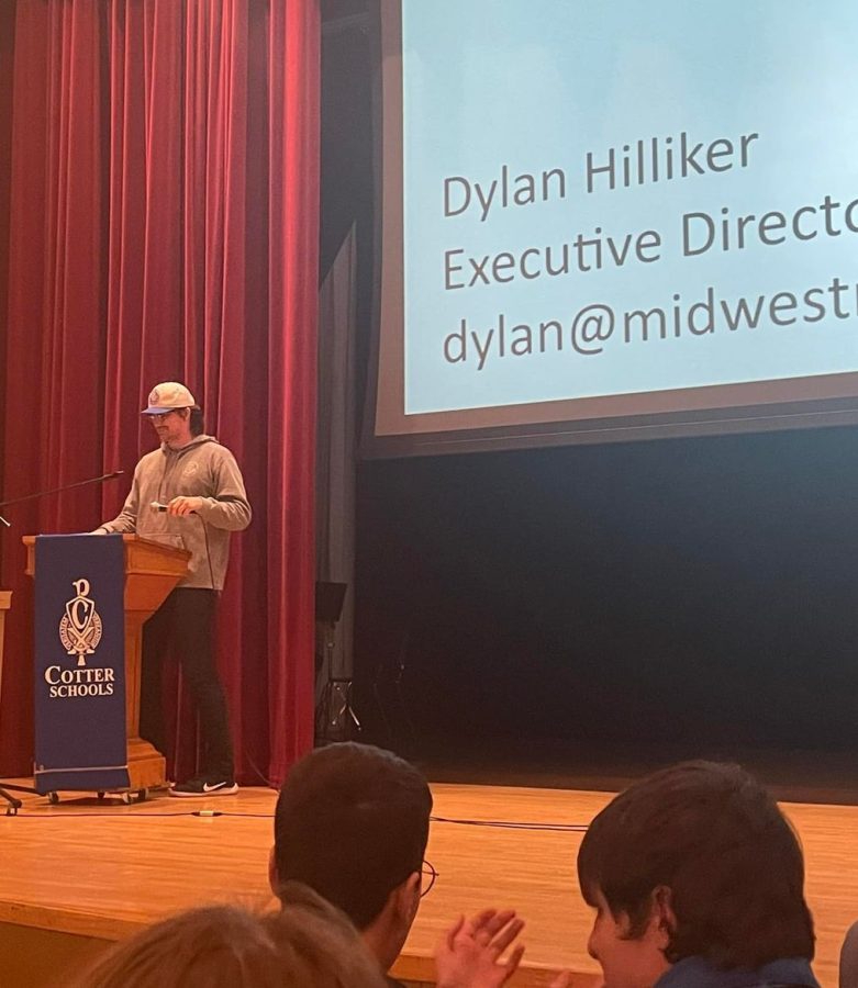 Dylan Hilliker addresses the students at Cotter informing them about this year's festival 