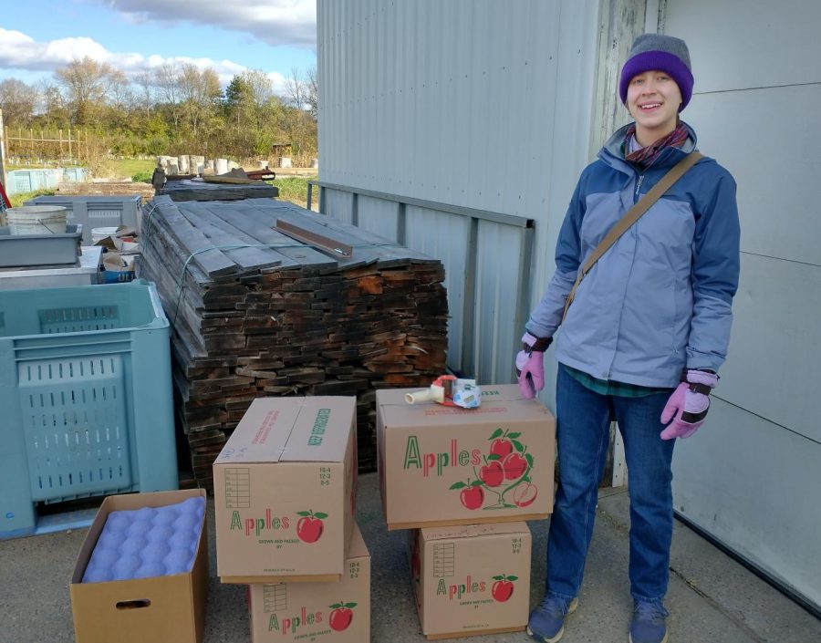 Grace Finnerty at work at behind a storage shed at Ecker's Apple Orchard in Centerville, Wisconsin