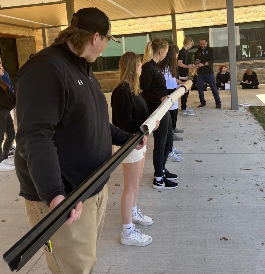 Mr. Paulsen's 2nd period physics class doing some kinesthetic learning outside of the St. Joseph building