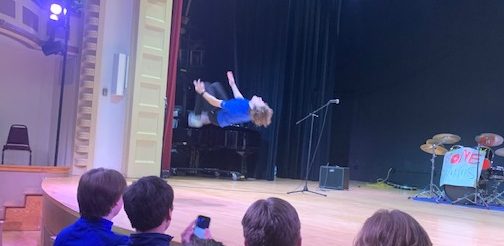 Eliot Fitzgeralds does an impromptu backflip in between acts of the talent show