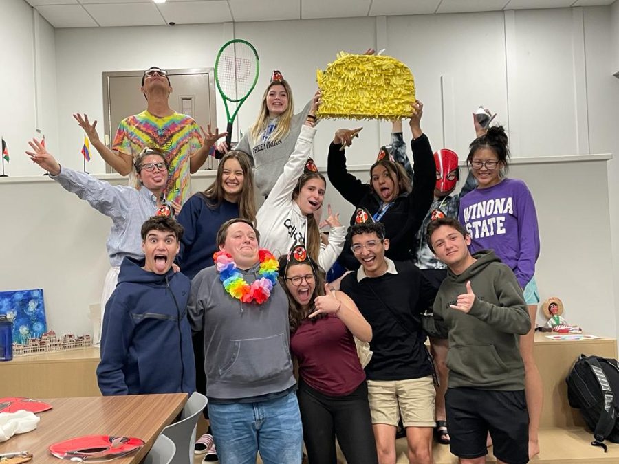 The international students with Trevor Young at his surprise party