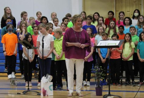 Mrs. Olstad listens to Mrs. Fitch thanking her at her final concert after more than 40 years of teaching