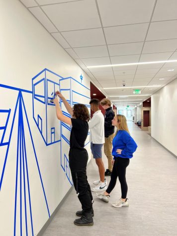 Intro to Art class students working on a tape mural on the 3rd floor of the St. Joseph
building