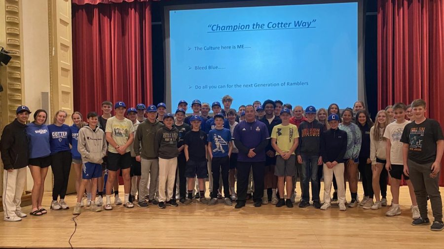 WSU football coach TOm Sawyer and Cotter athletes on the stage at St. Cecilia