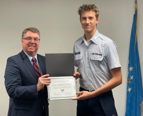 Wisconsin State senator Brad Pfaff presents Sam Littrell with the Cadet of the Quarter award. 