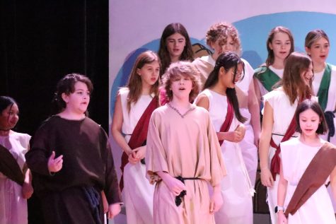 Junior high students performing When in Rome